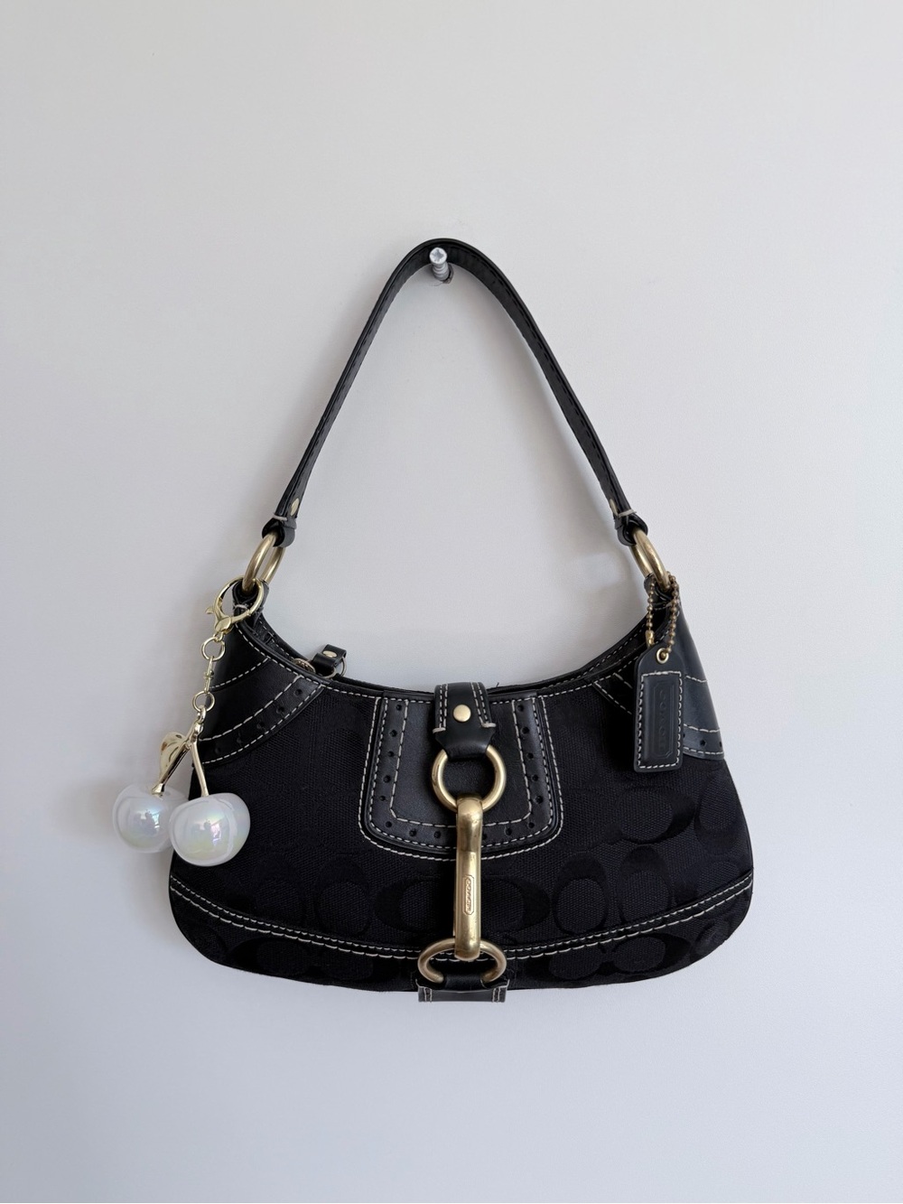 Coach Black Signature Canvas Shoulder Bag with Gold-Tone Hardware and Charm